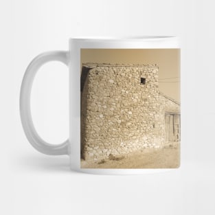 Old stone building with dilapidated wooden doors Mug